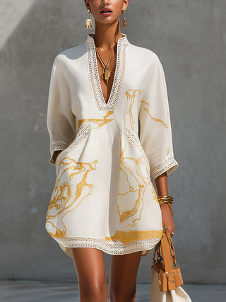 Aliénor Gold Motif Mini Dress